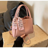 حقيبة يد ورديه اللون عملية بسعة مناسبة وشريط ملون - KSA