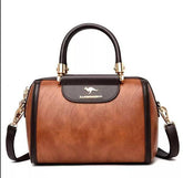 حقيبة باللون البني صغيرة بيد صغيرة وحزام طويل لحملها على الكتف. - KSA