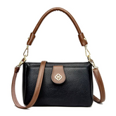 حقيبة كتف نسائية لون اسود بتفاصيل بنية ولمسة زخرفية ذهبية - KSA