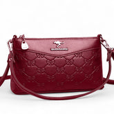 حقيبة كتف نسائية كروس بودي لون عنابي منقوشة بفيونكات أنيقة - KSA