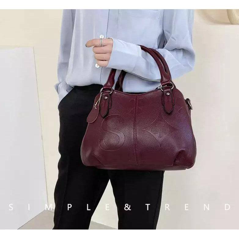 شنطة يد نسائية عصرية من الجلد المرن - عنابي - KSA