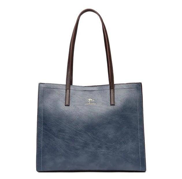 حقيبة كتف باللون الازرق الغامق وذراع بنى اللون متوسطة الحجم وبملمس ناعم - KSA