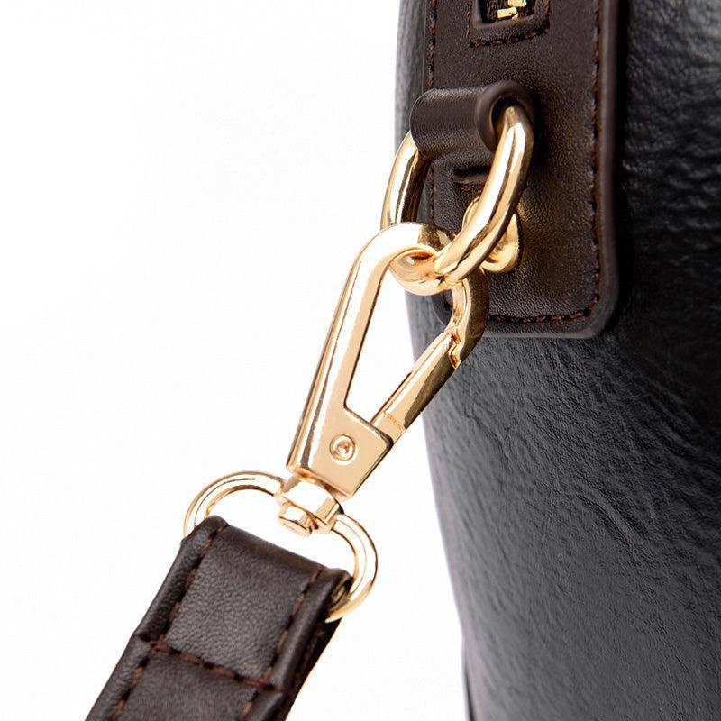 حقيبة باللون البني صغيرة بيد صغيرة وحزام طويل لحملها على الكتف. - KSA