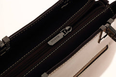 حقيبة يد نسائية باللون الاسود الغامق متوسطة الحجم بيد مريحة وبملمس وتصميم مميز. - KSA