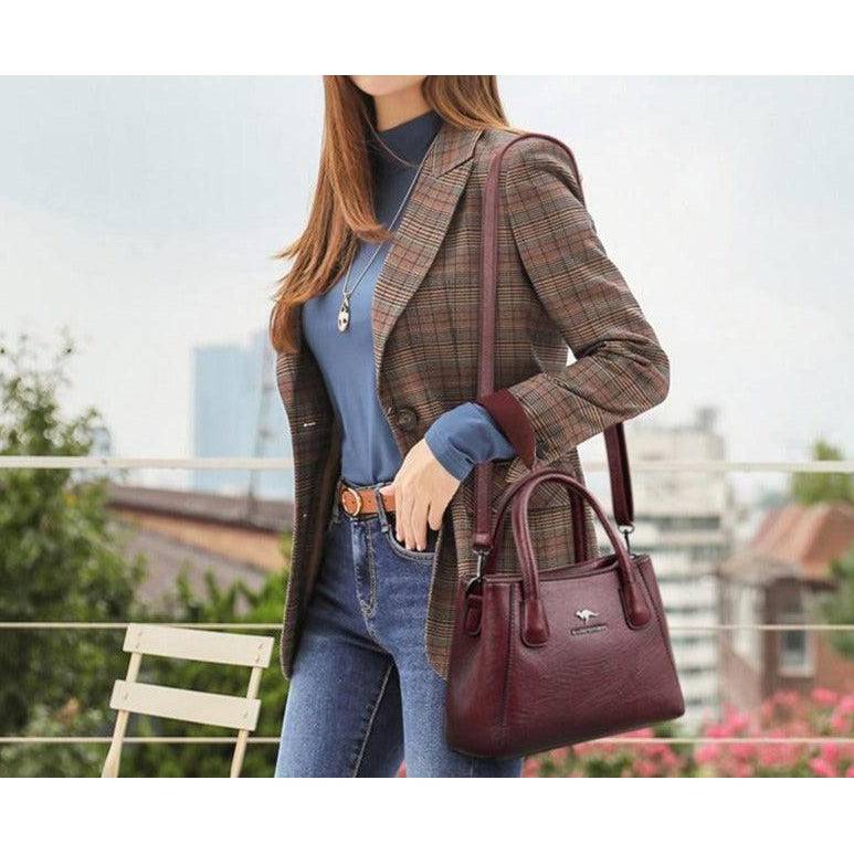 شنطة يد نسائية صغيرة من الجلد بتصميم كلاسيكي رقيق - عنابي - KSA